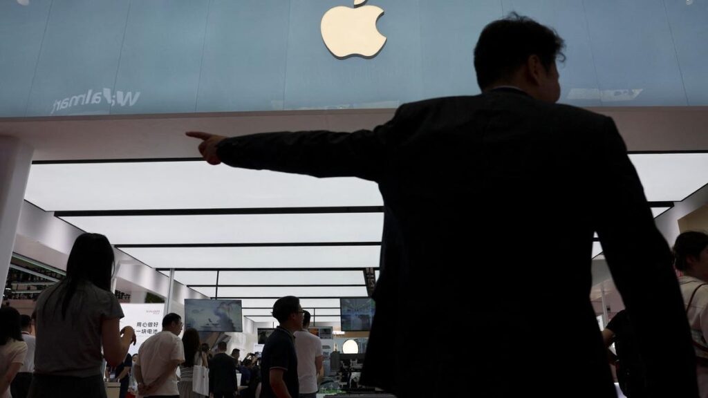 Apple logo over a digital cloud background representing iCloud storage services.