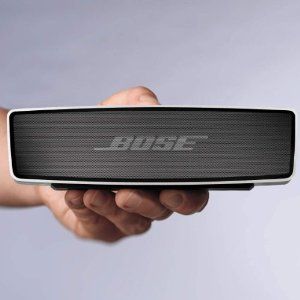 Sleek Bose Smart Ultra Soundbar with Dolby Atmos placed below flat-screen TV"