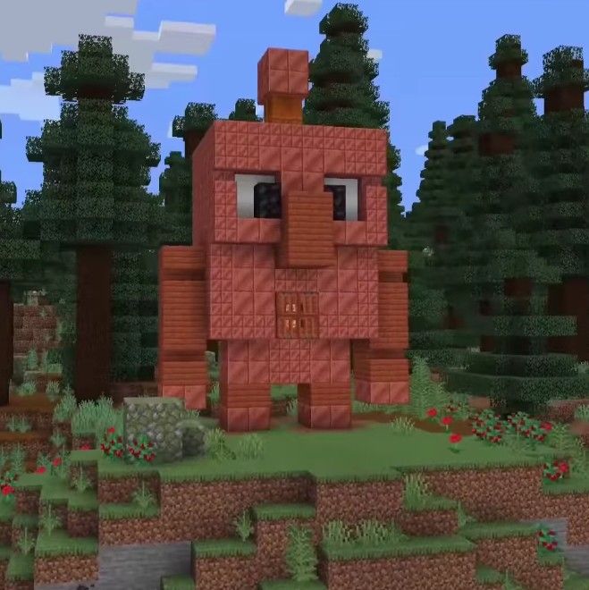 Minecraft Copper Golem statue in oxidized pose with redstone connection