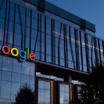 Illustration of hacker stealing data from Google database with digital breach concept