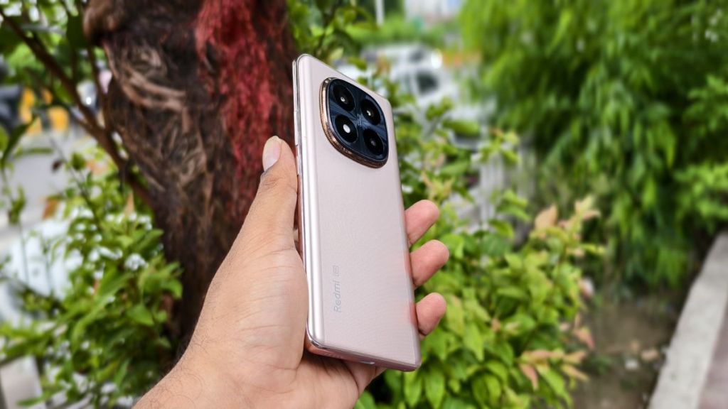 Redmi Note 14 Pro+ 5G in Champagne Gold showcasing its sleek design with a 6.67-inch AMOLED display and centered punch-hole camera