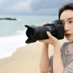 Close-up of the Nikon NIKKOR Z 24-70mm f/2.8 S II professional mirrorless camera lens showing its compact, weather-sealed design and control ring.